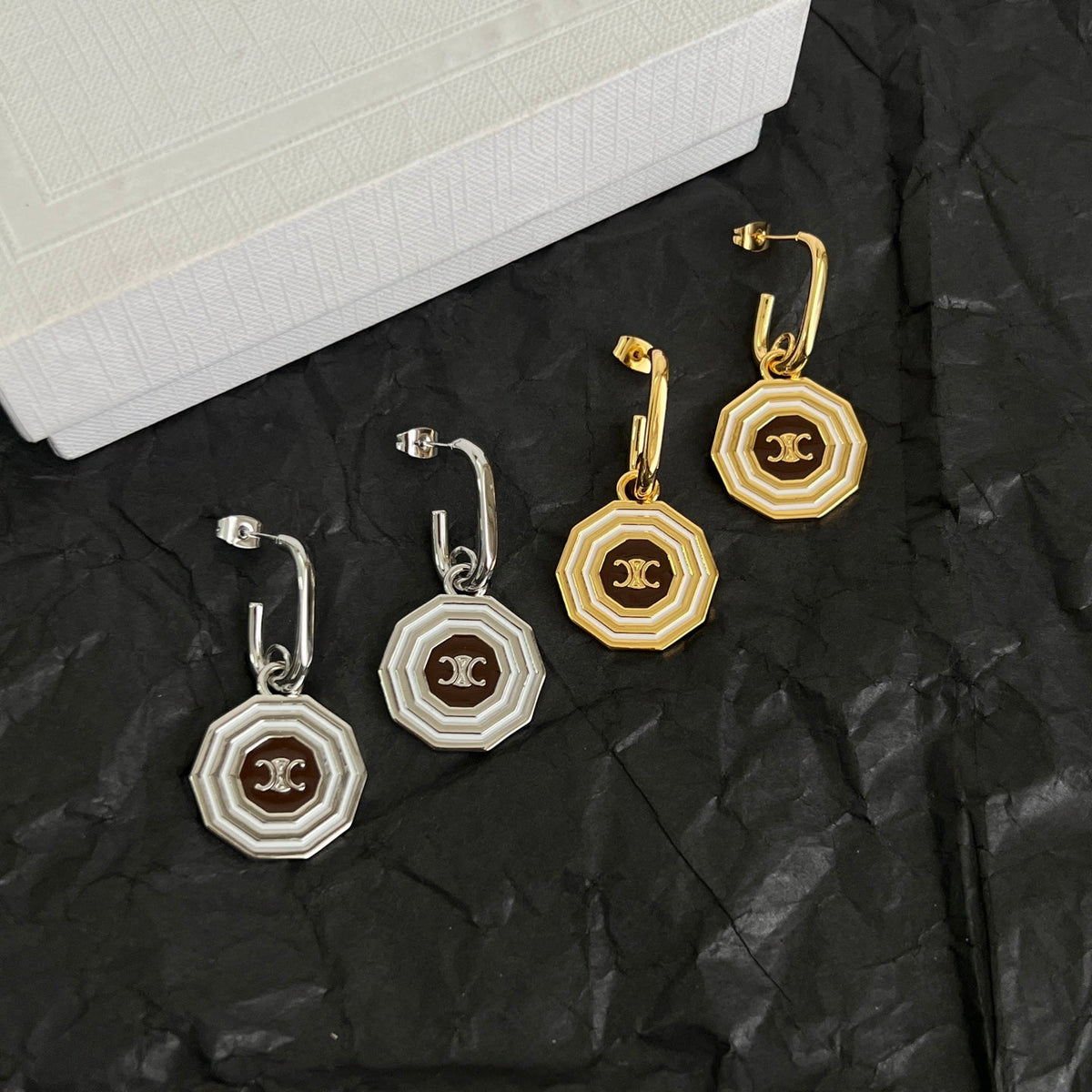 Martin Graham stud earrings in polished metal-tone – front view