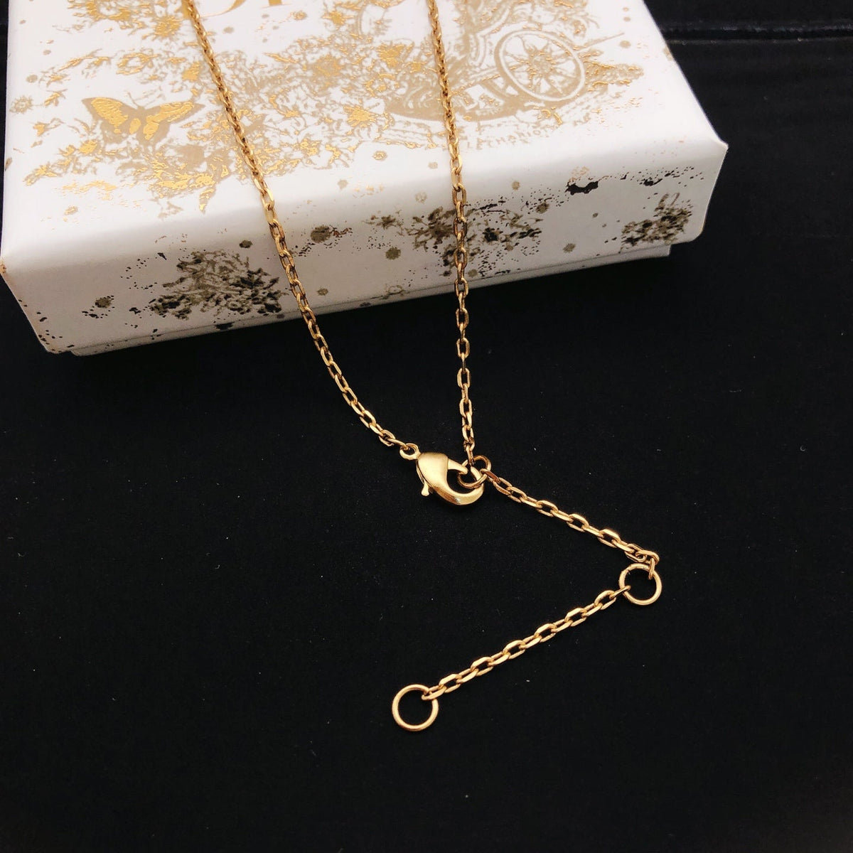 Martin Graham pendant necklace in polished metal-tone – front view