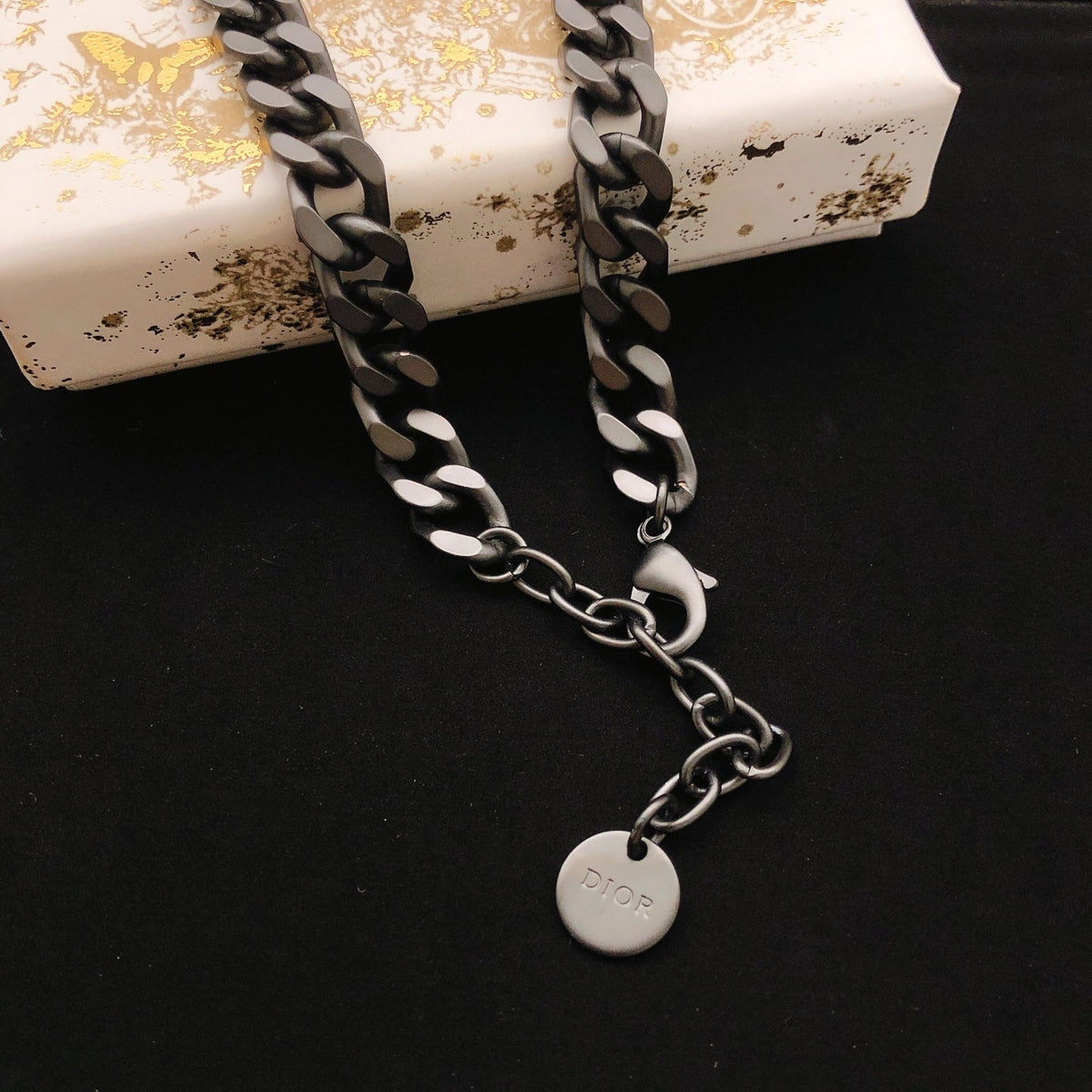 Martin Graham pendant necklace in polished metal-tone – front view
