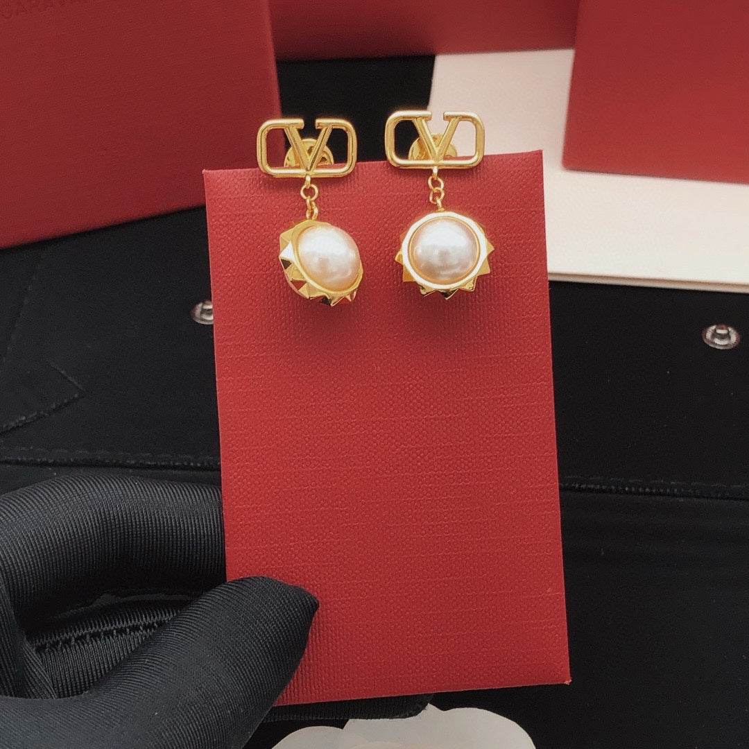 Martin Graham stud earrings in polished metal-tone – front view