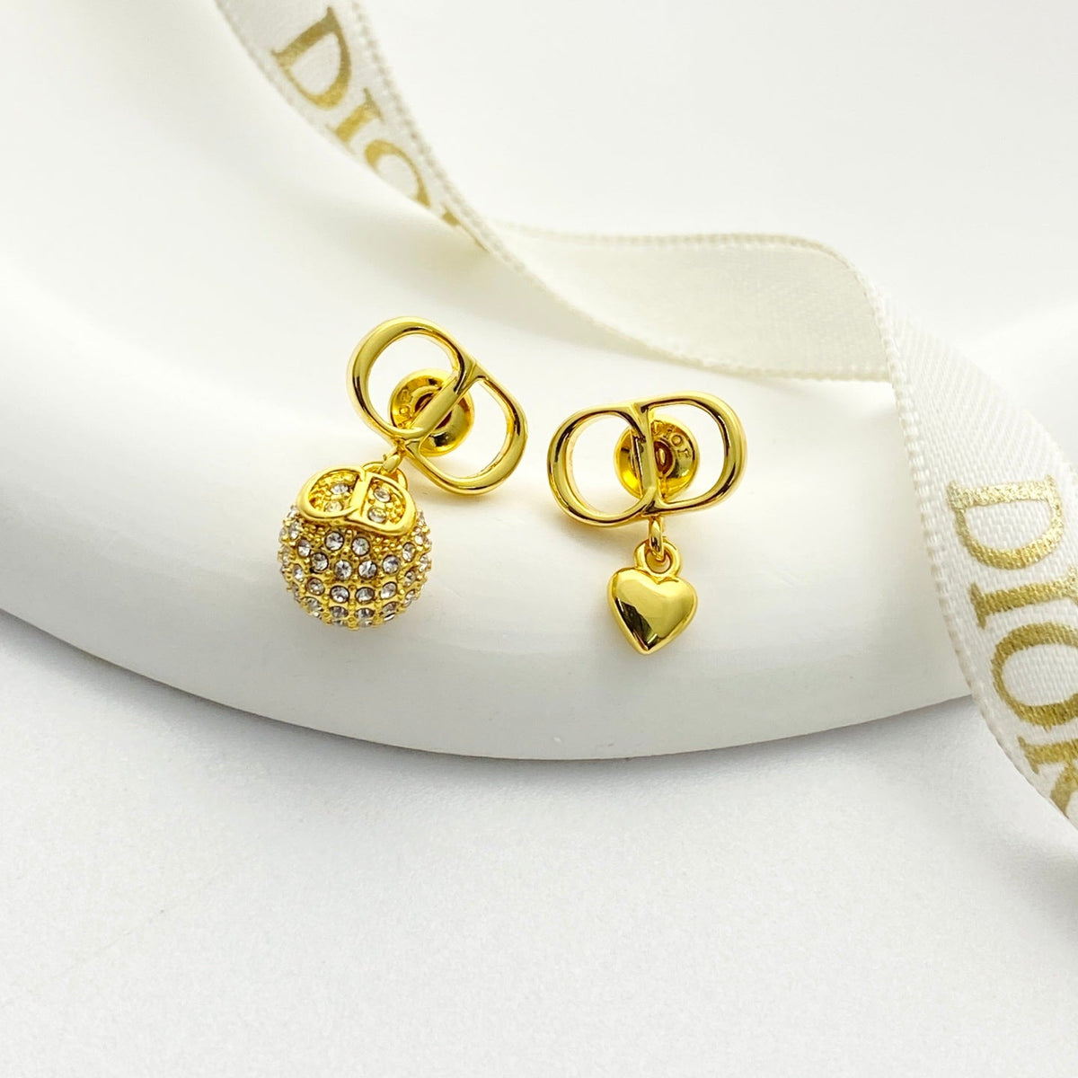 Martin Graham stud earrings in polished metal-tone – front view