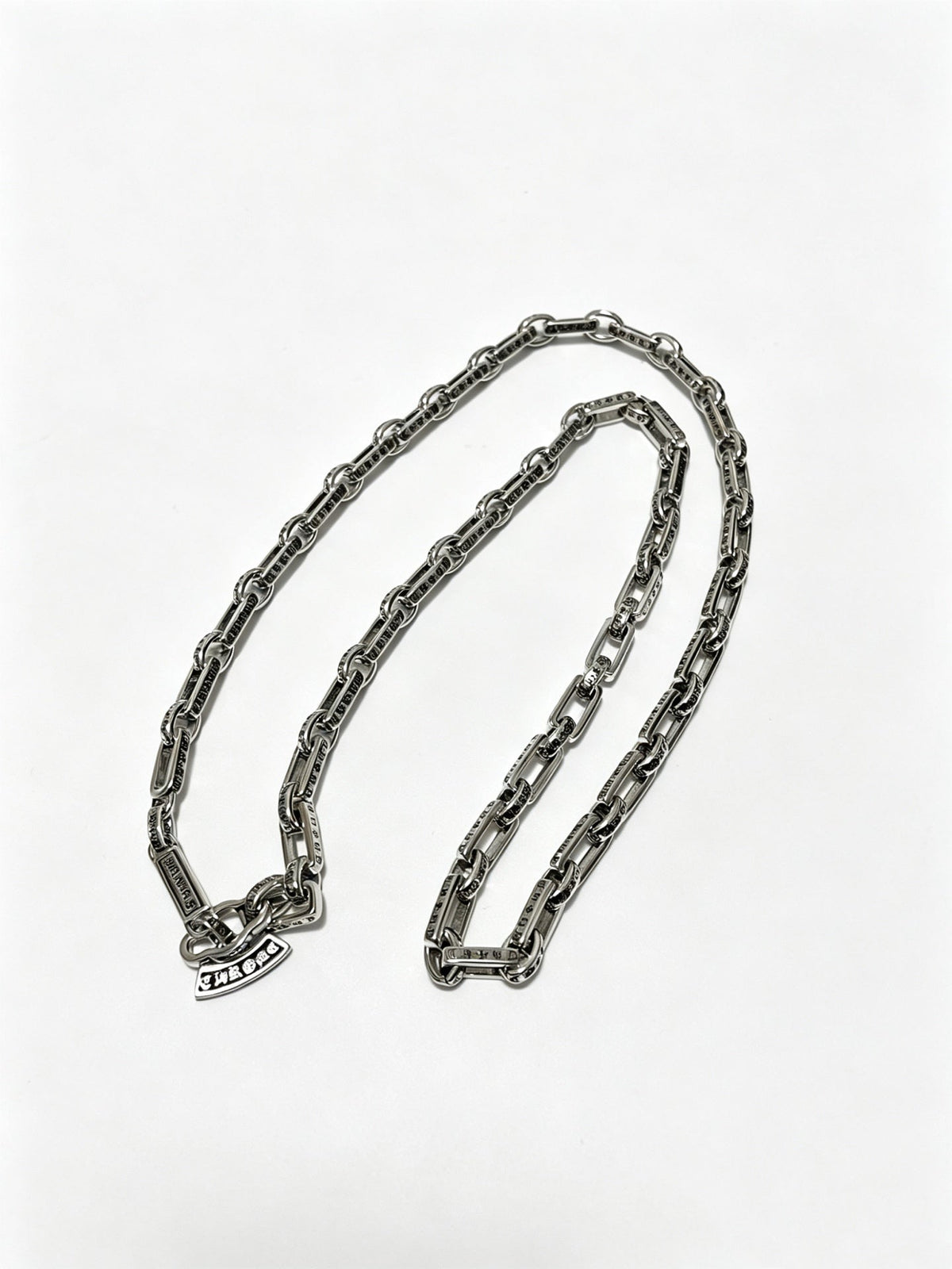 Martin Graham pendant necklace in polished metal-tone – front product view