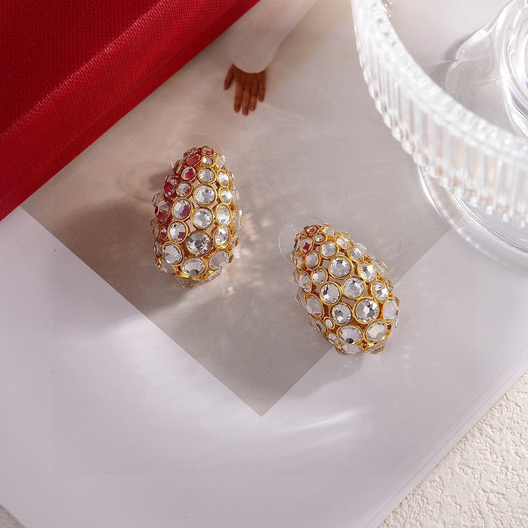 Martin Graham stud earrings in polished metal-tone – front view