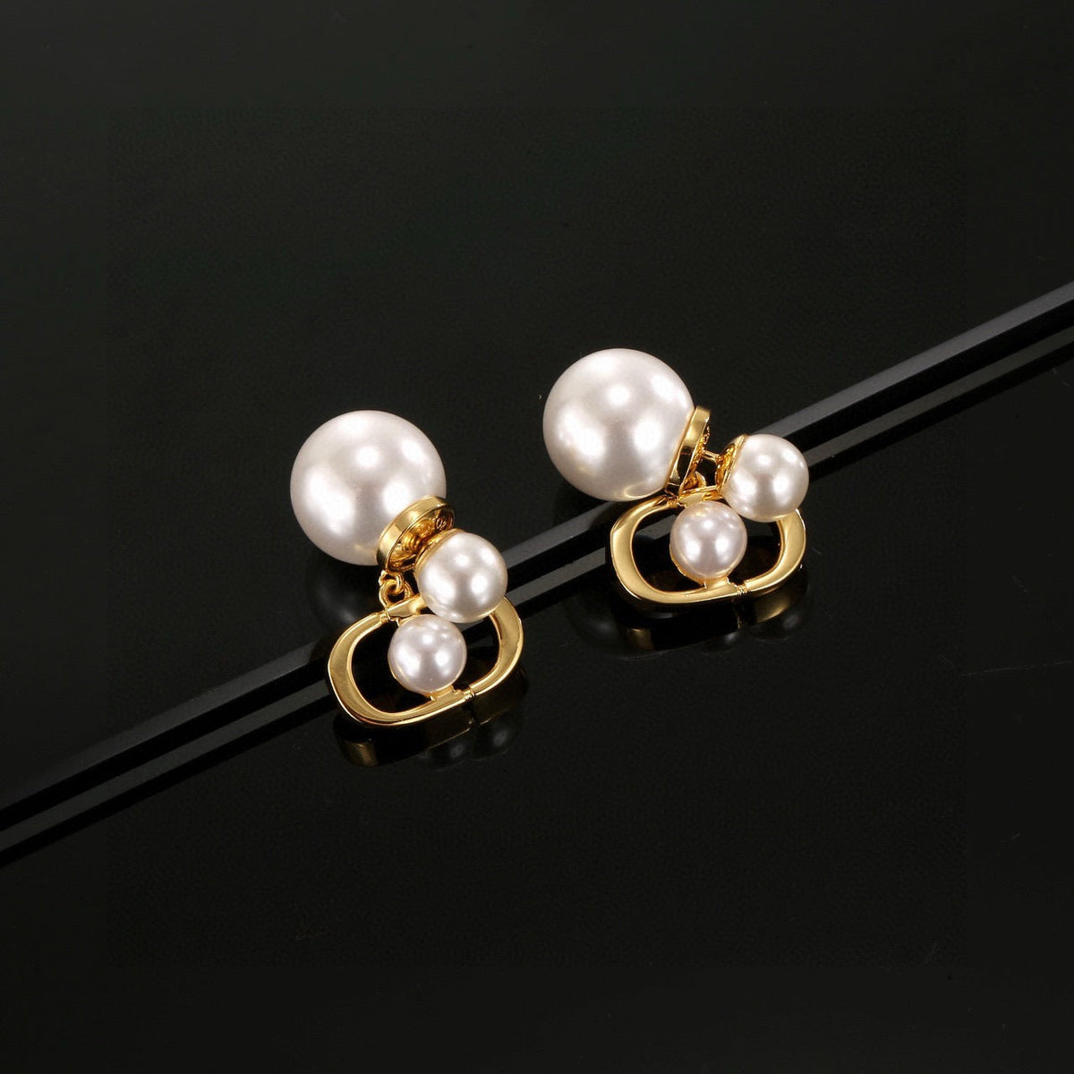 Martin Graham earrings in polished metal-tone – front view