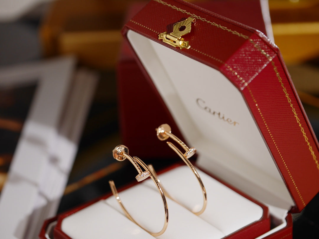 Martin Graham earrings in polished metal-tone – front view