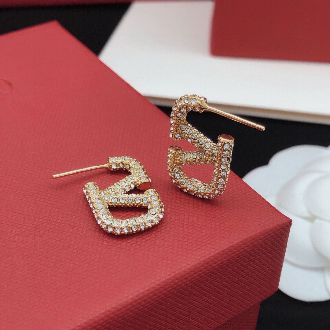 Martin Graham stud earrings in polished metal-tone – front view