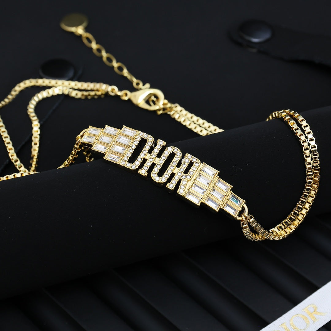Martin Graham pendant necklace in polished metal-tone – front view
