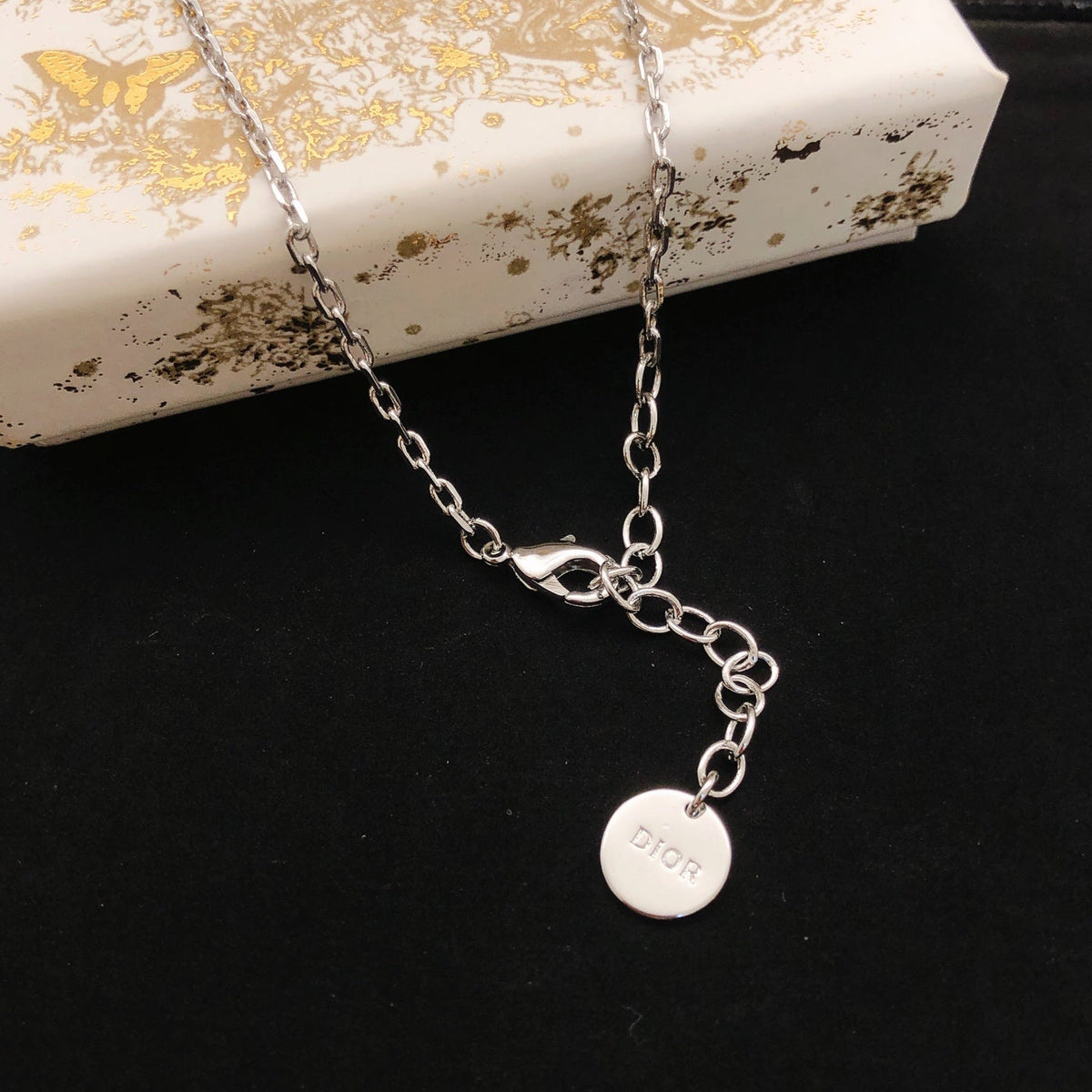 Martin Graham pendant necklace in polished metal-tone – front view