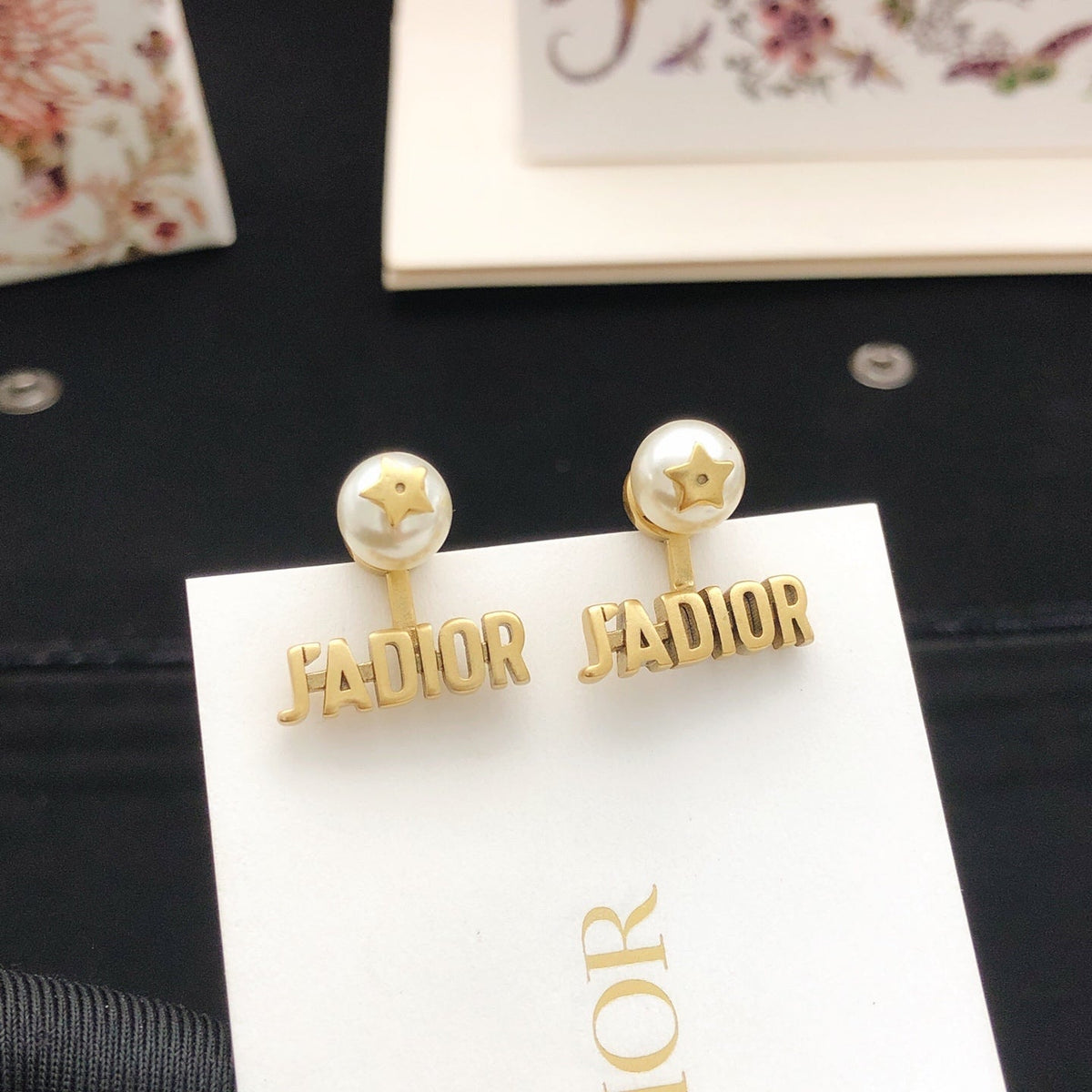 Martin Graham stud earrings in polished metal-tone – front view