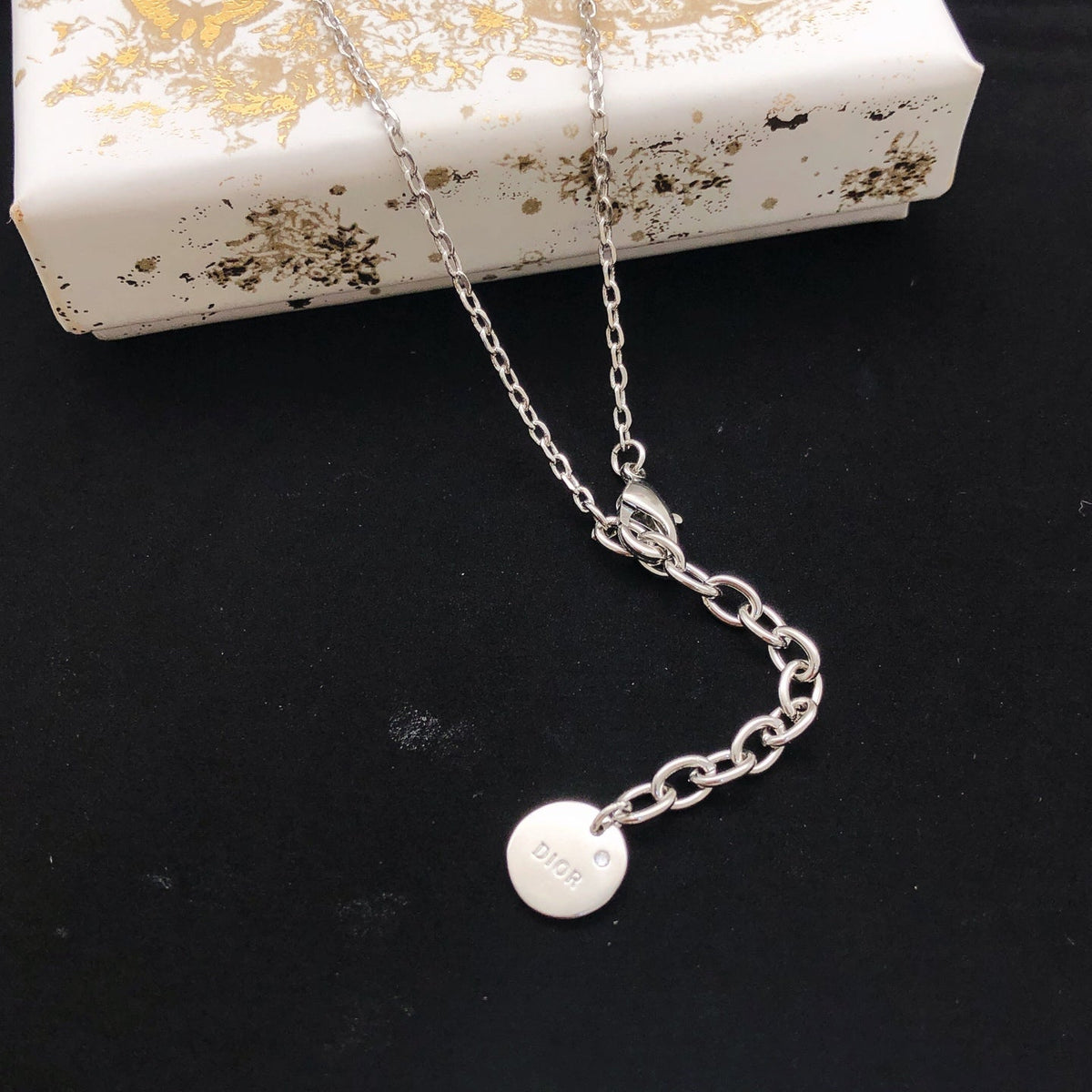 Martin Graham pendant necklace in polished metal-tone – front view