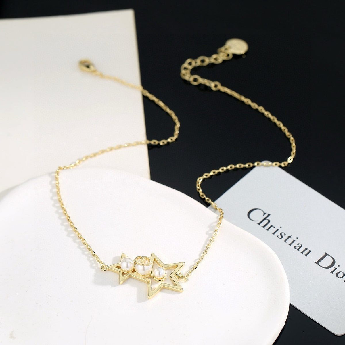Martin Graham pendant necklace in polished metal-tone – front view