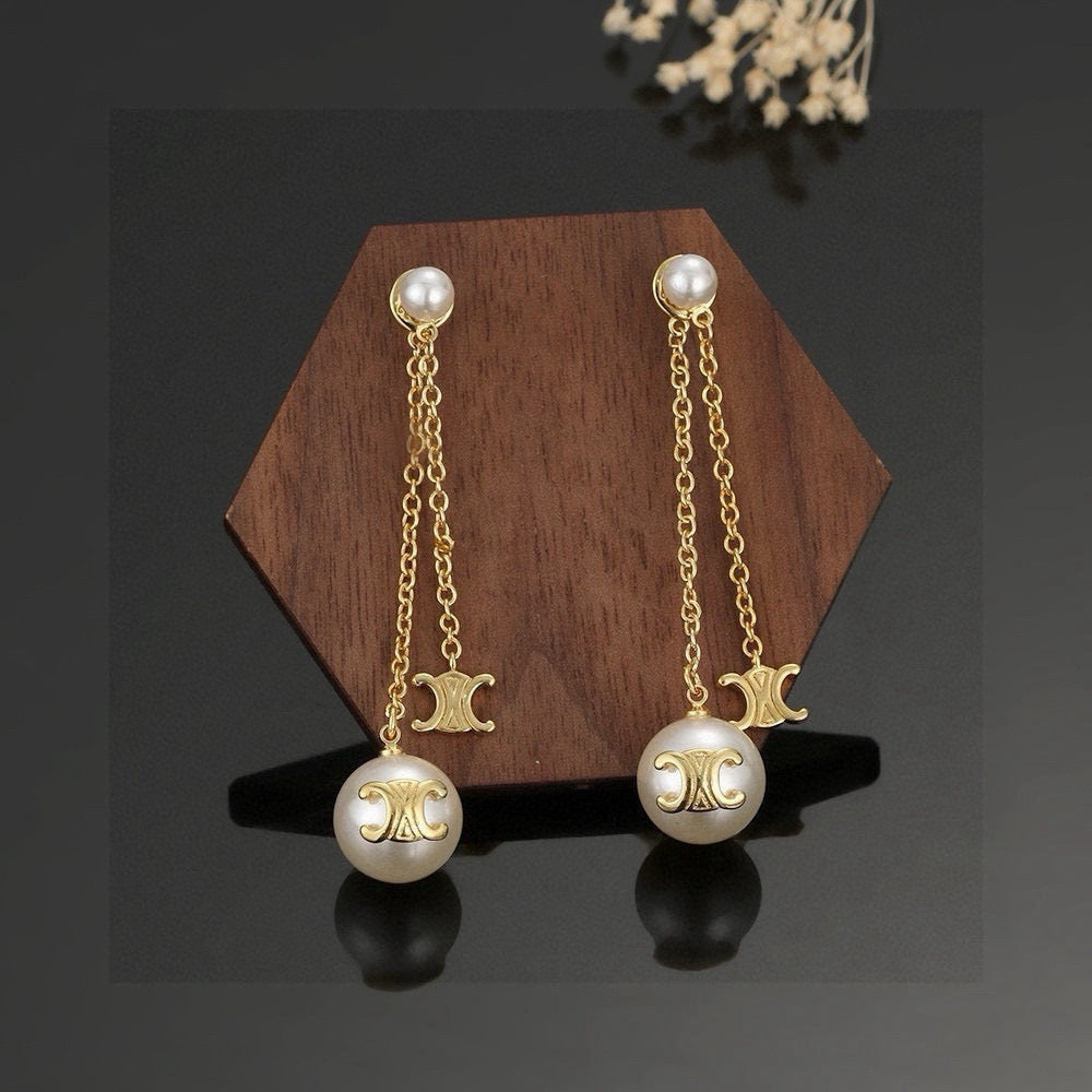 Martin Graham stud earrings in polished metal-tone – front view