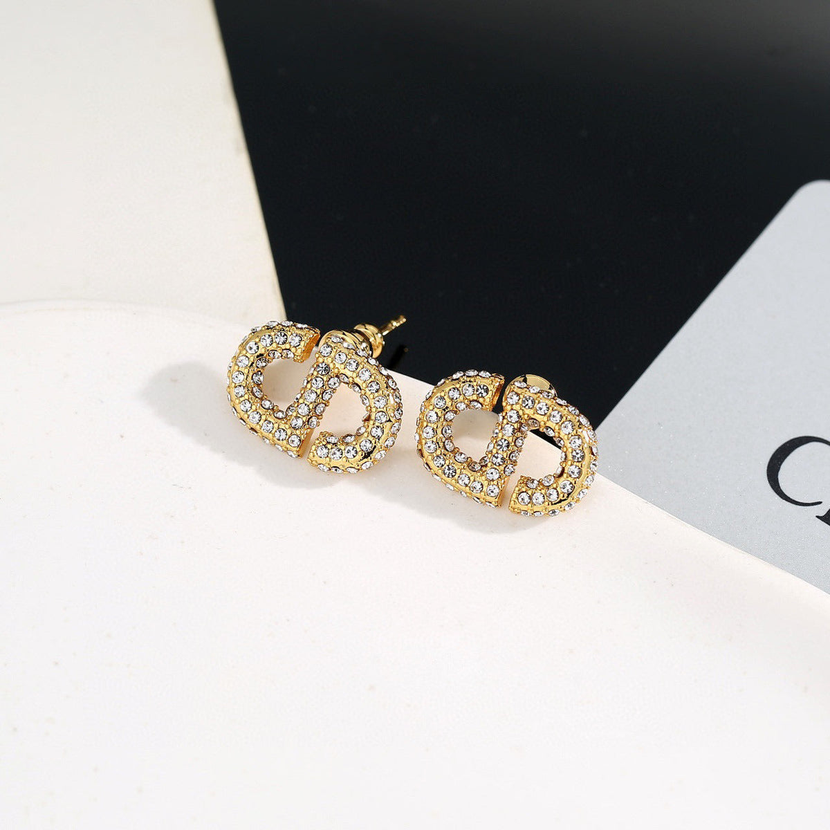 Martin Graham stud earrings in polished metal-tone – front view