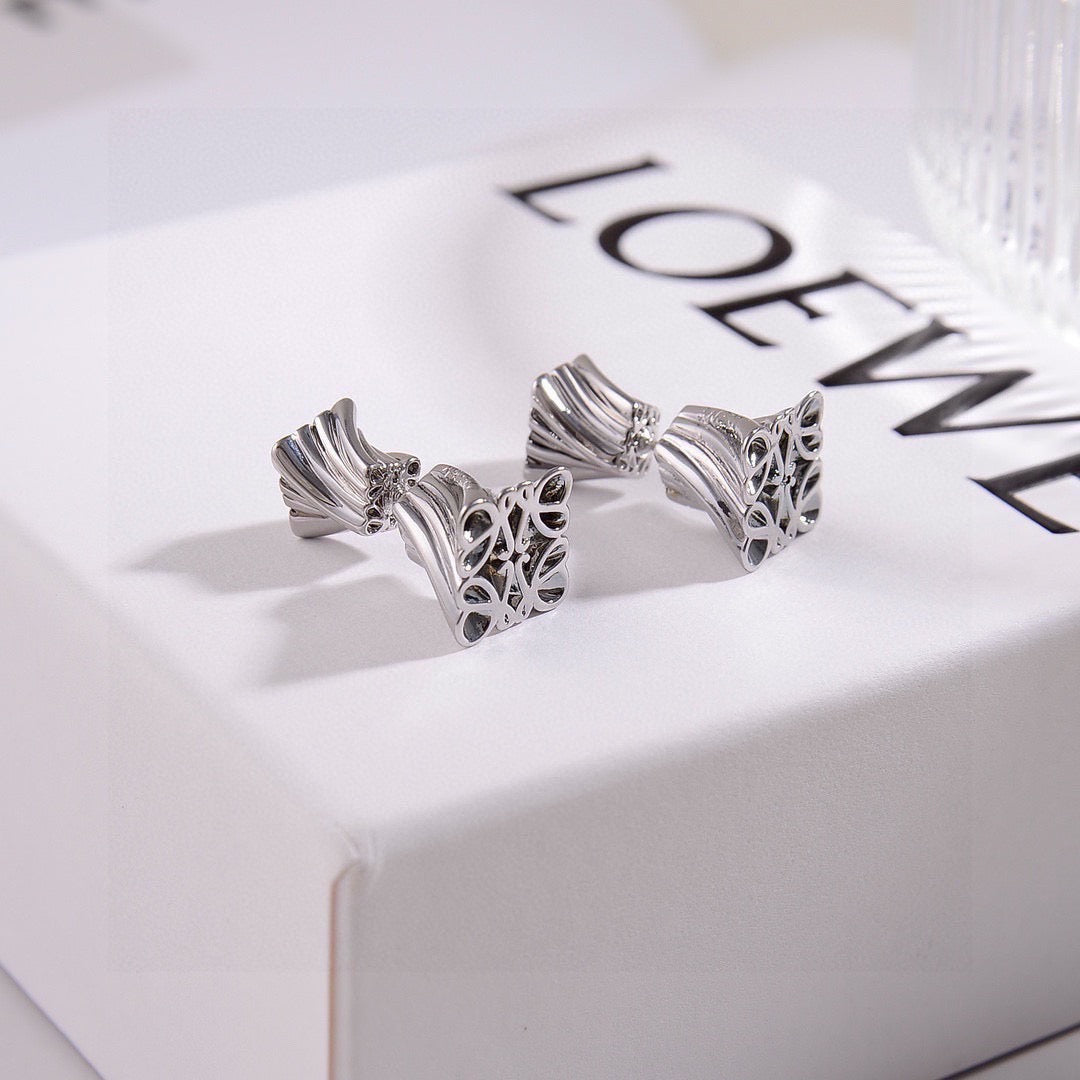 Martin Graham stud earrings in polished metal-tone – front view