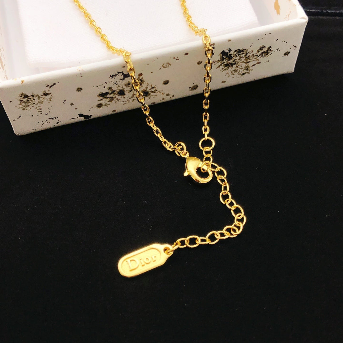Martin Graham pendant necklace in polished metal-tone – front view