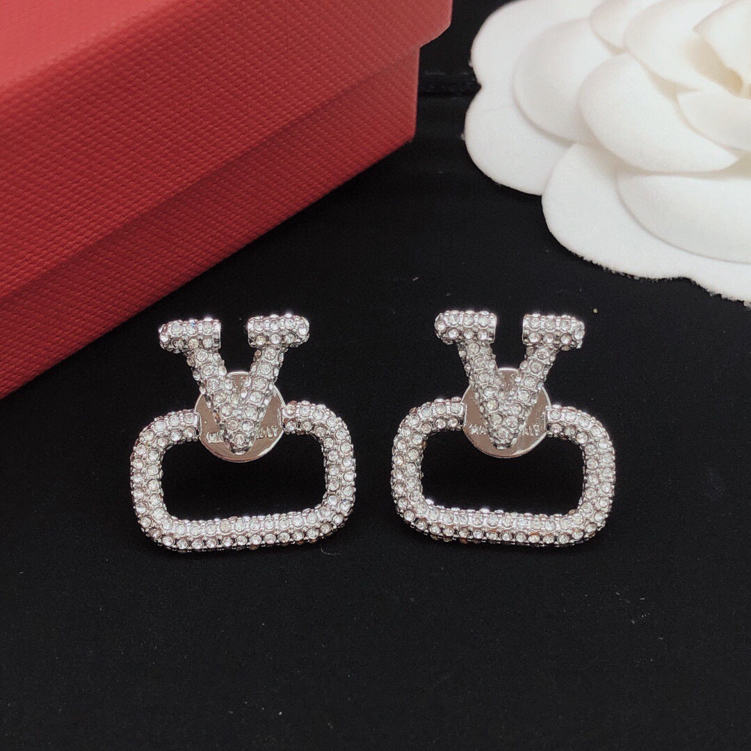Martin Graham stud earrings in polished metal-tone – front view