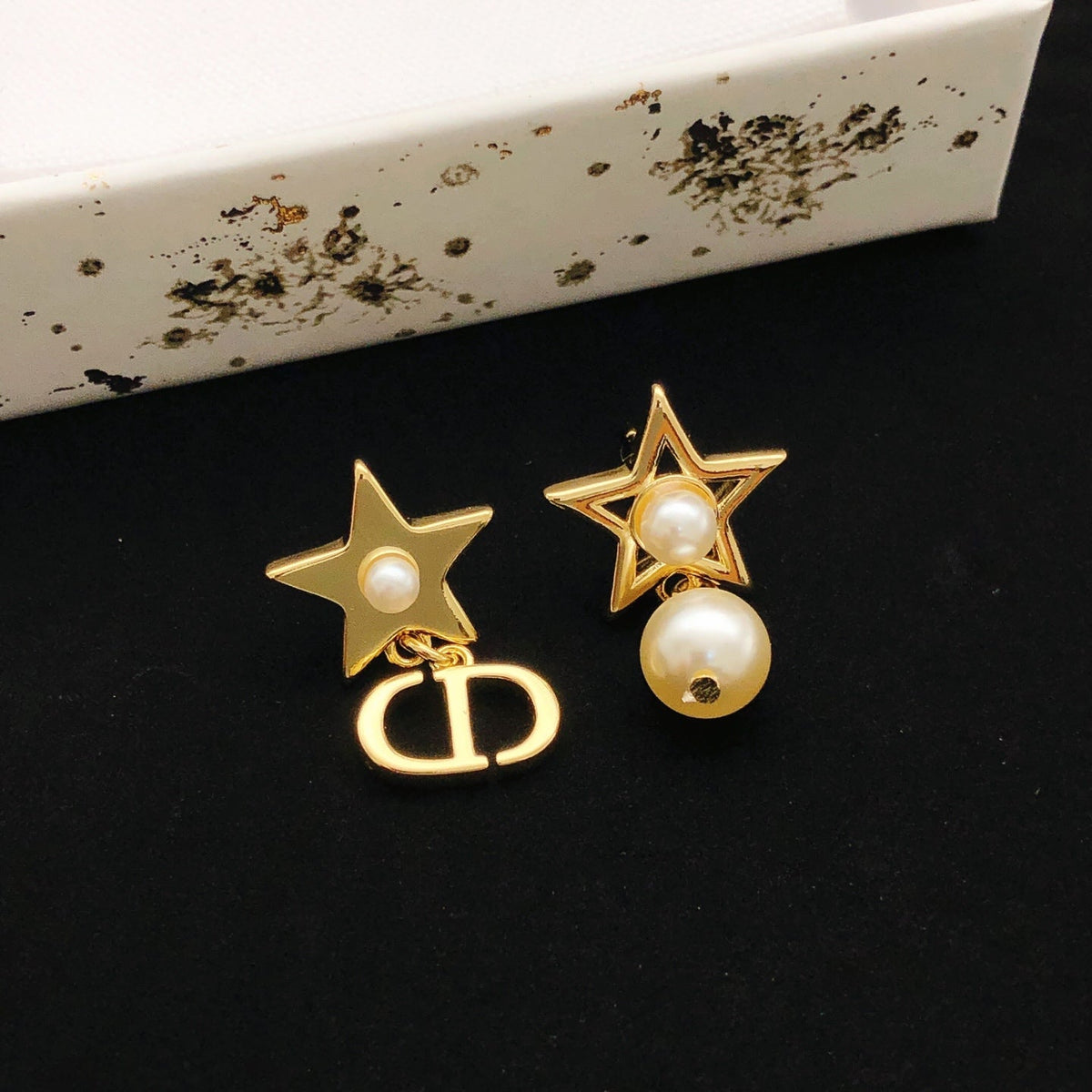 Martin Graham stud earrings in polished metal-tone – front view