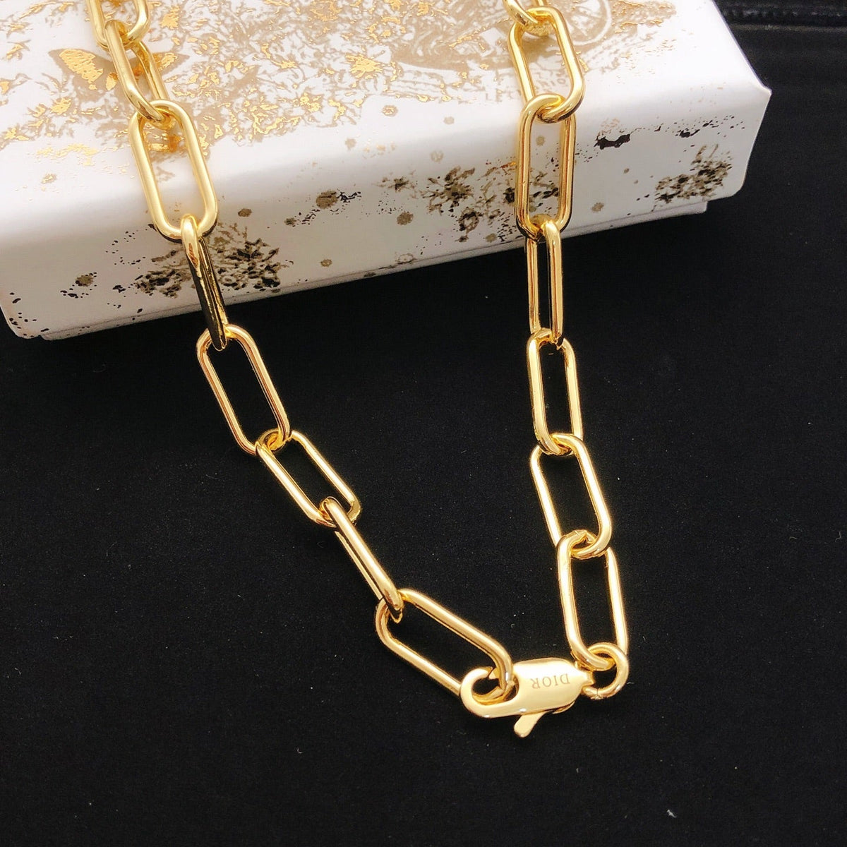 Martin Graham pendant necklace in polished metal-tone – front view