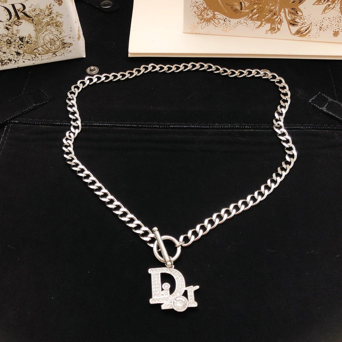 Martin Graham pendant necklace in polished metal-tone – front view