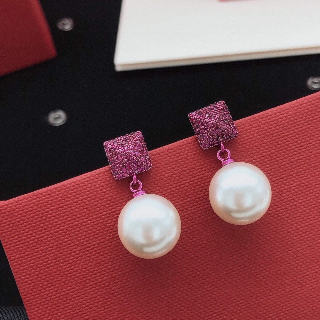 Martin Graham stud earrings in polished metal-tone – front view