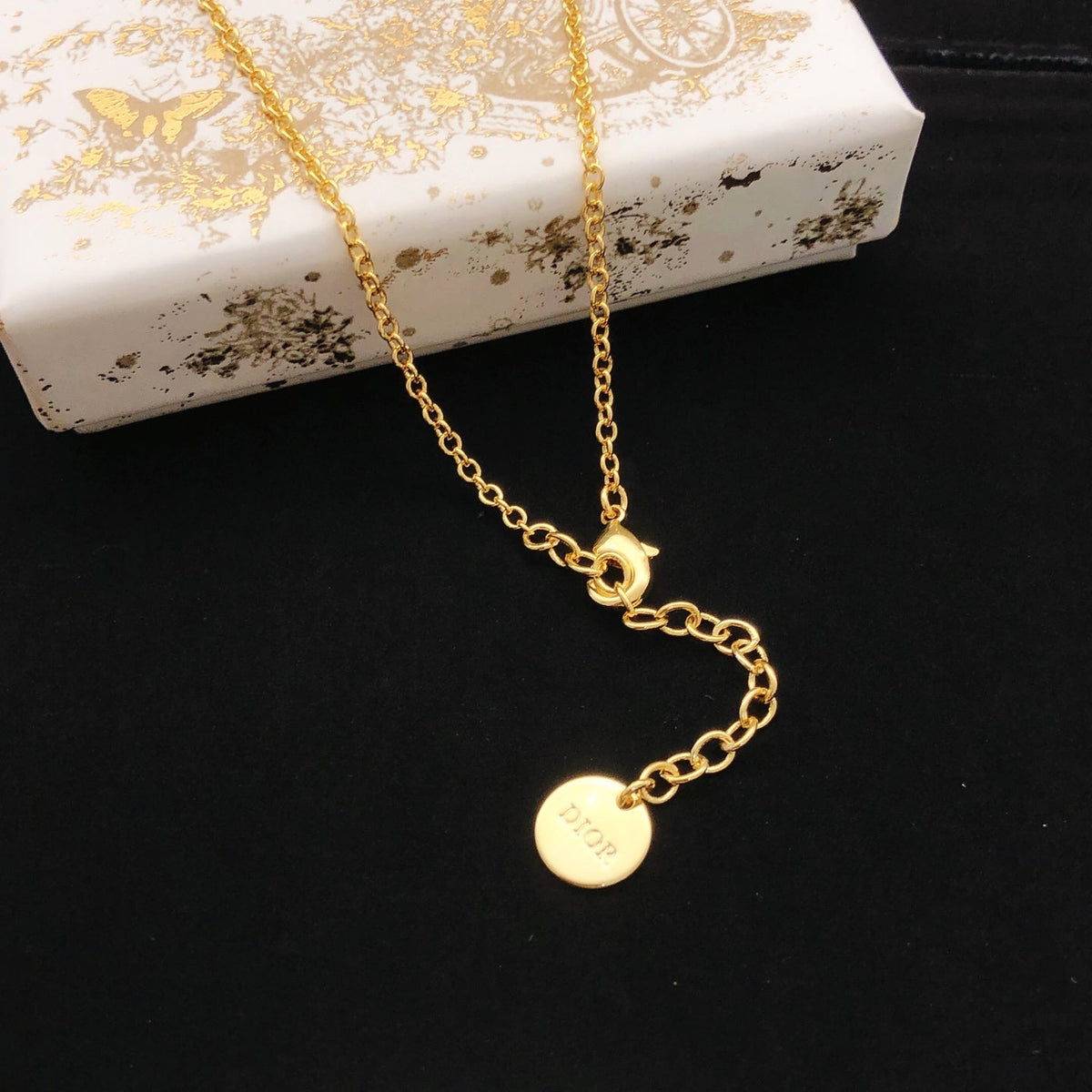 Martin Graham pendant necklace in polished metal-tone – front view