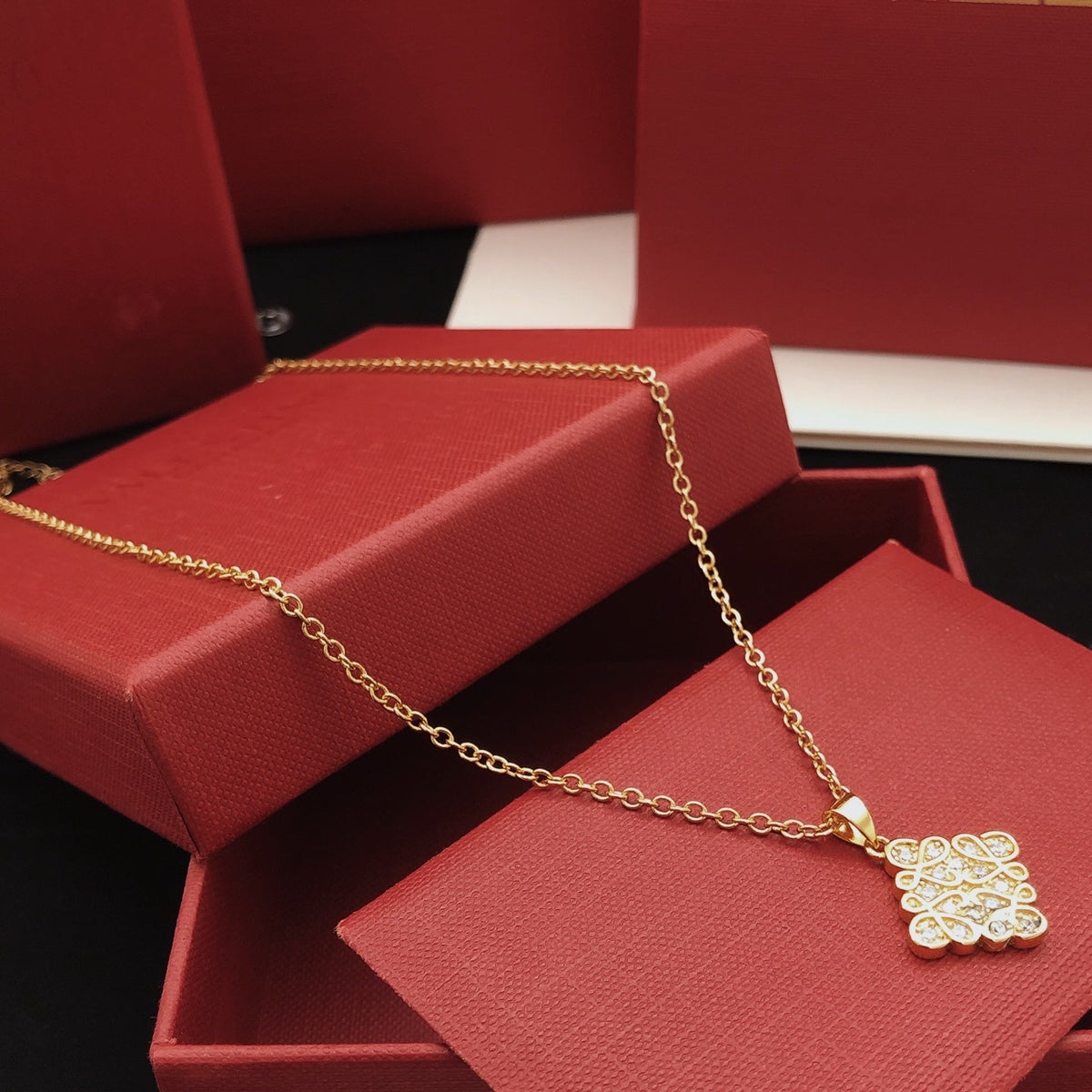 Martin Graham pendant necklace in polished metal-tone – front view
