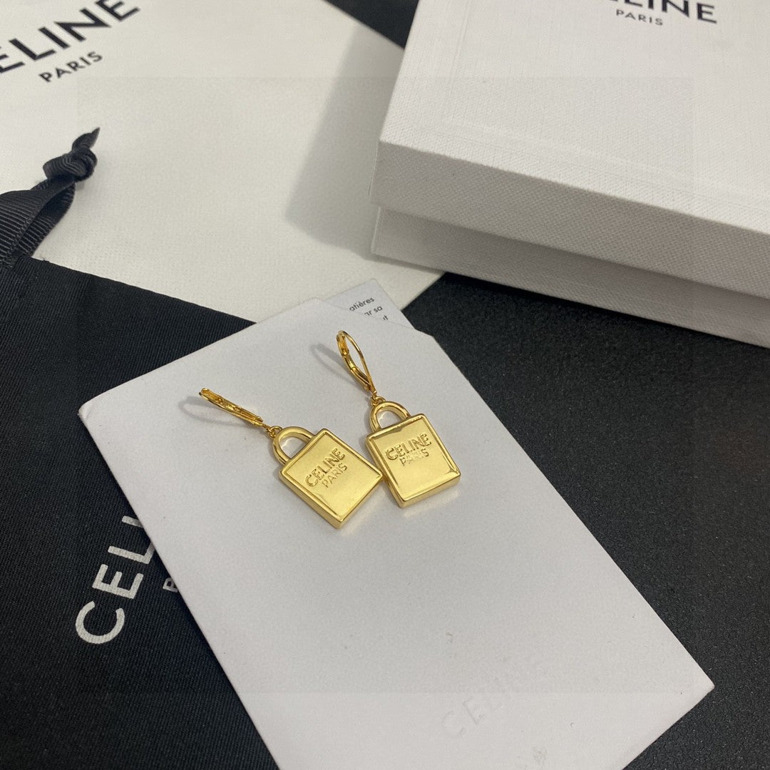 Martin Graham stud earrings in polished metal-tone – front view