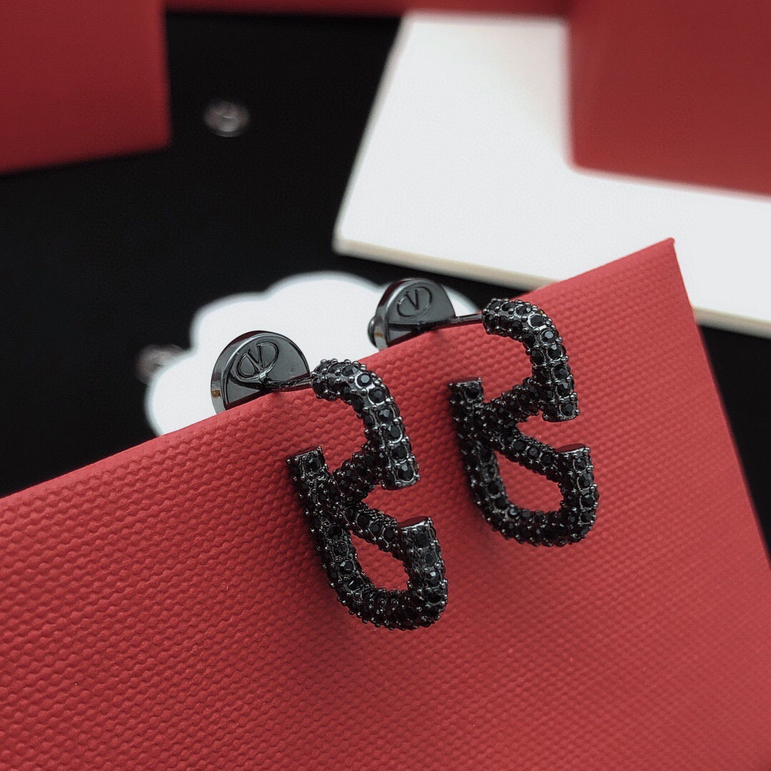 Martin Graham stud earrings in polished metal-tone – front view