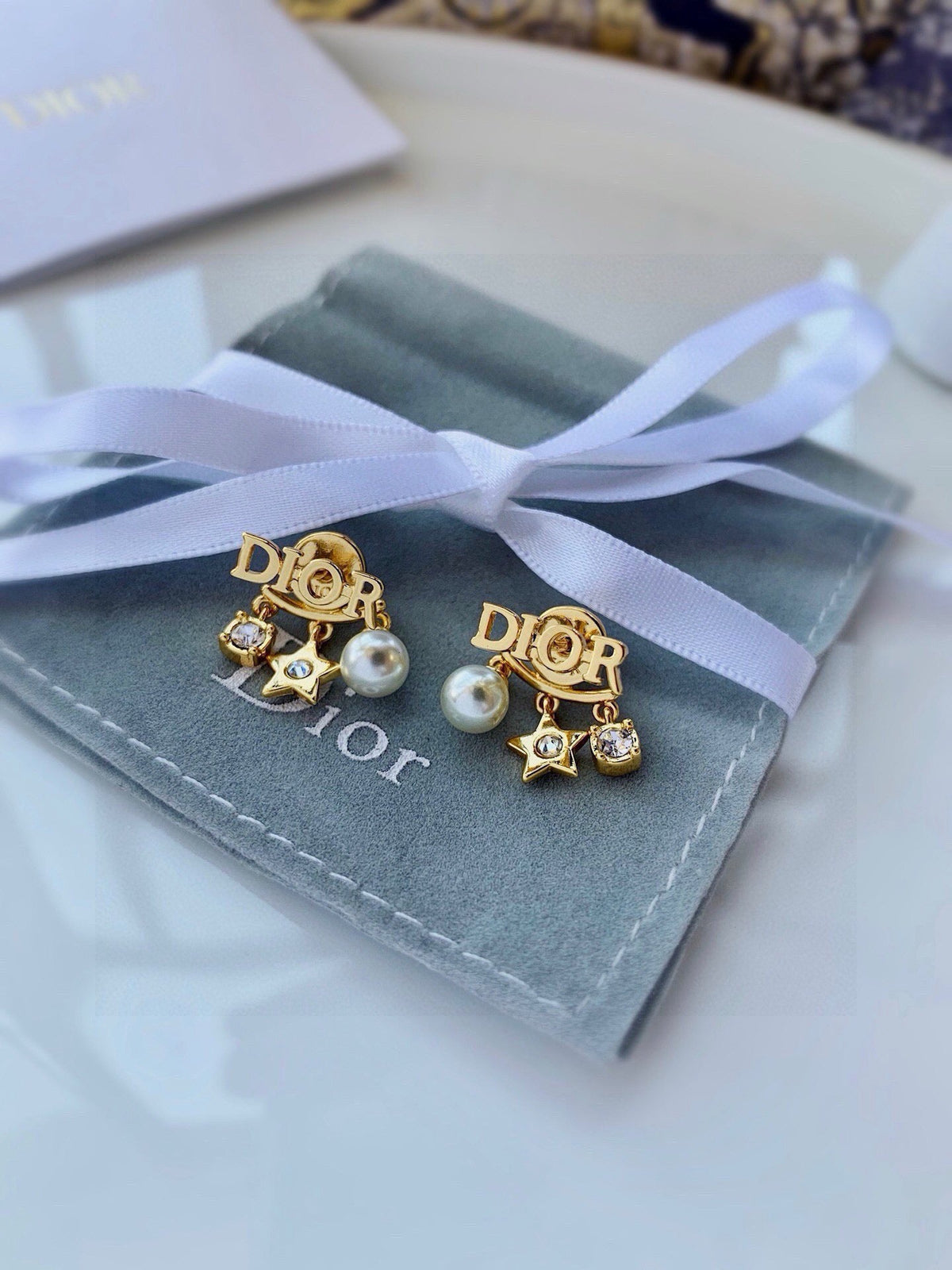 Martin Graham earrings in polished metal-tone – front view