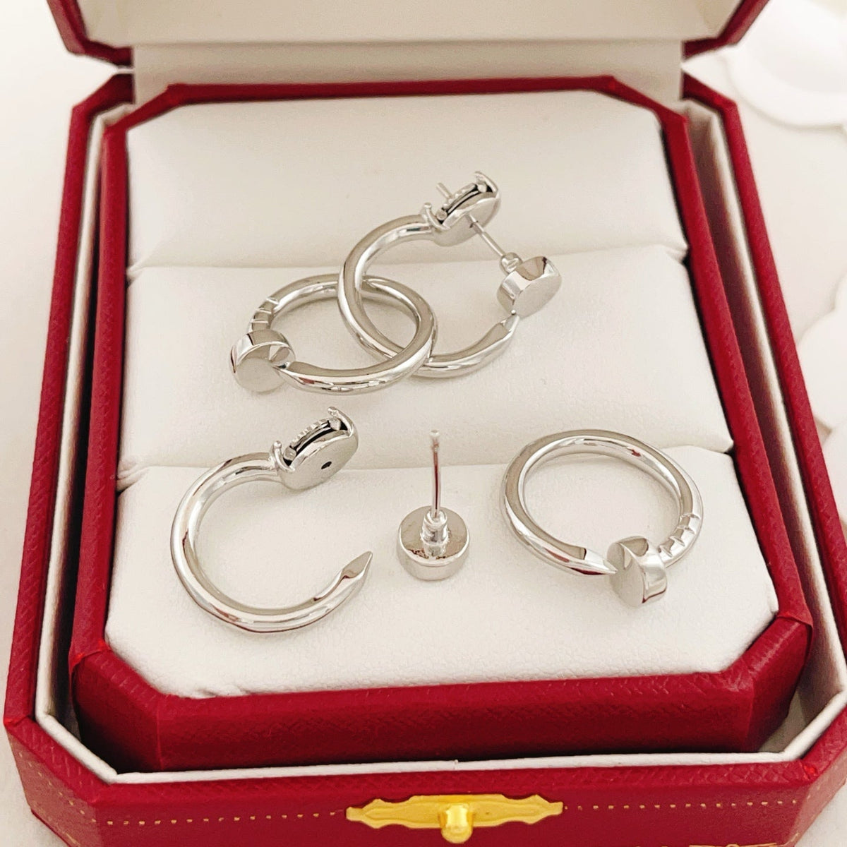Martin Graham earrings in polished metal-tone – front view