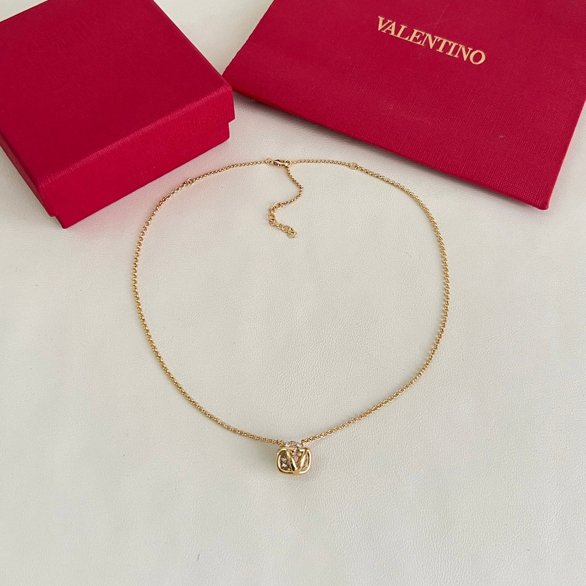 Martin Graham pendant necklace in polished metal-tone – front view