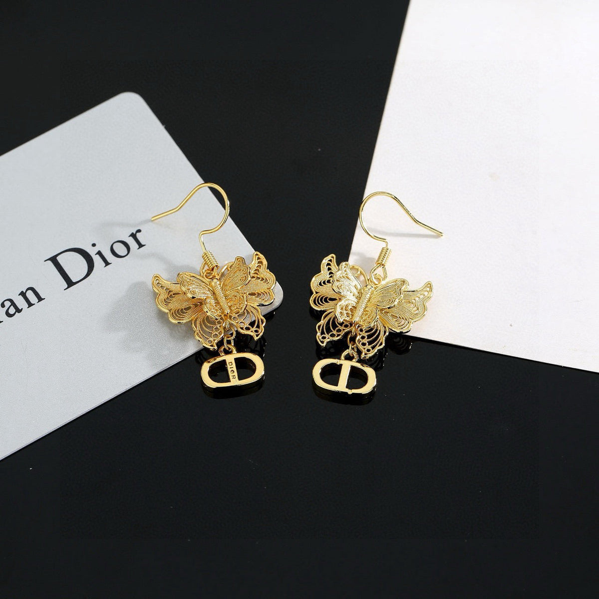 Martin Graham stud earrings in polished metal-tone – front view