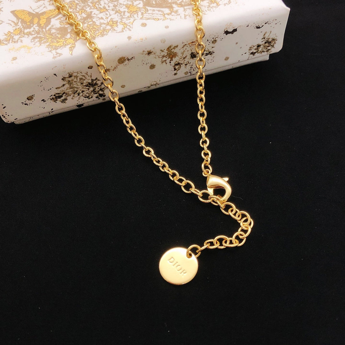 Martin Graham pendant necklace in polished metal-tone – front view