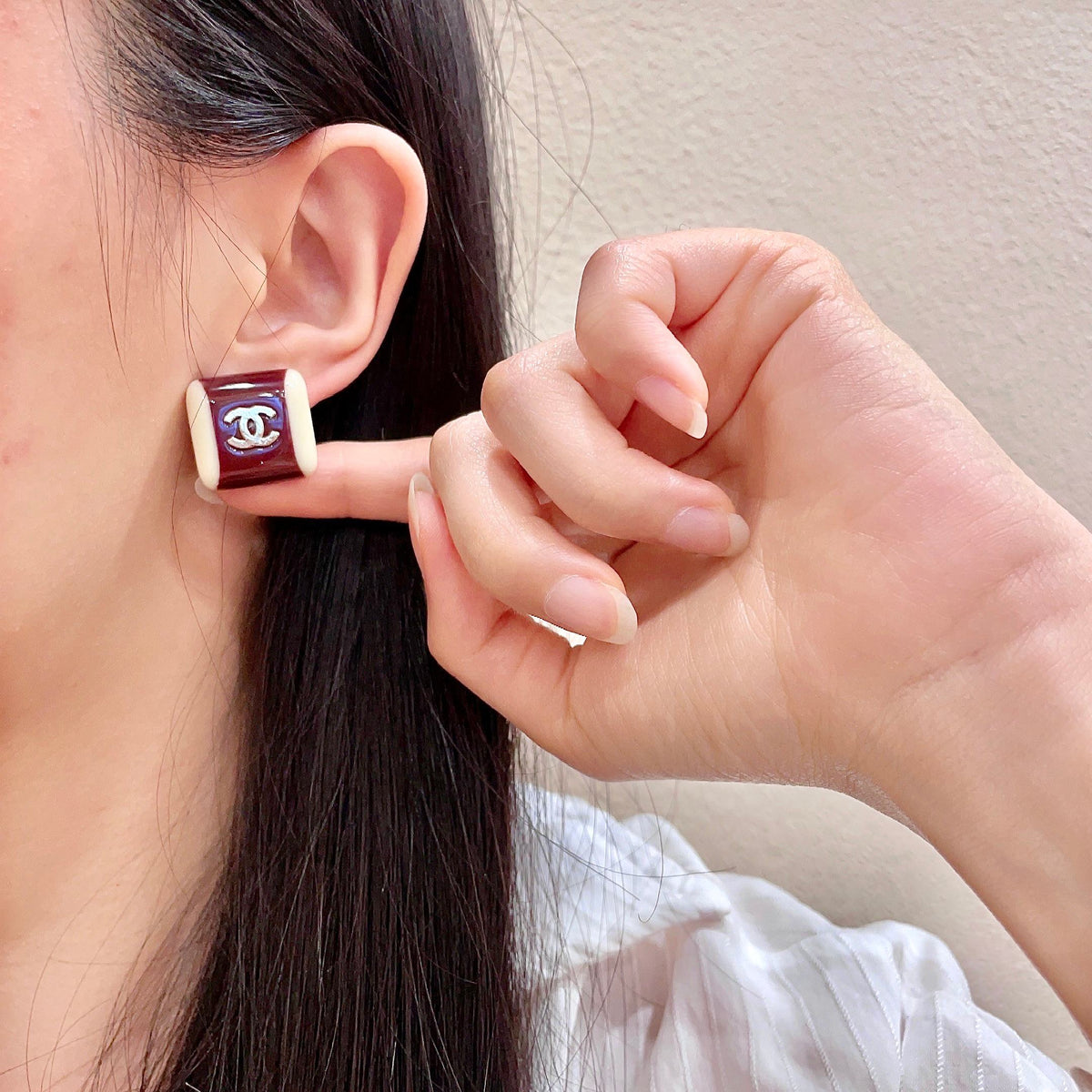 Martin Graham stud earrings in polished metal-tone – front product view