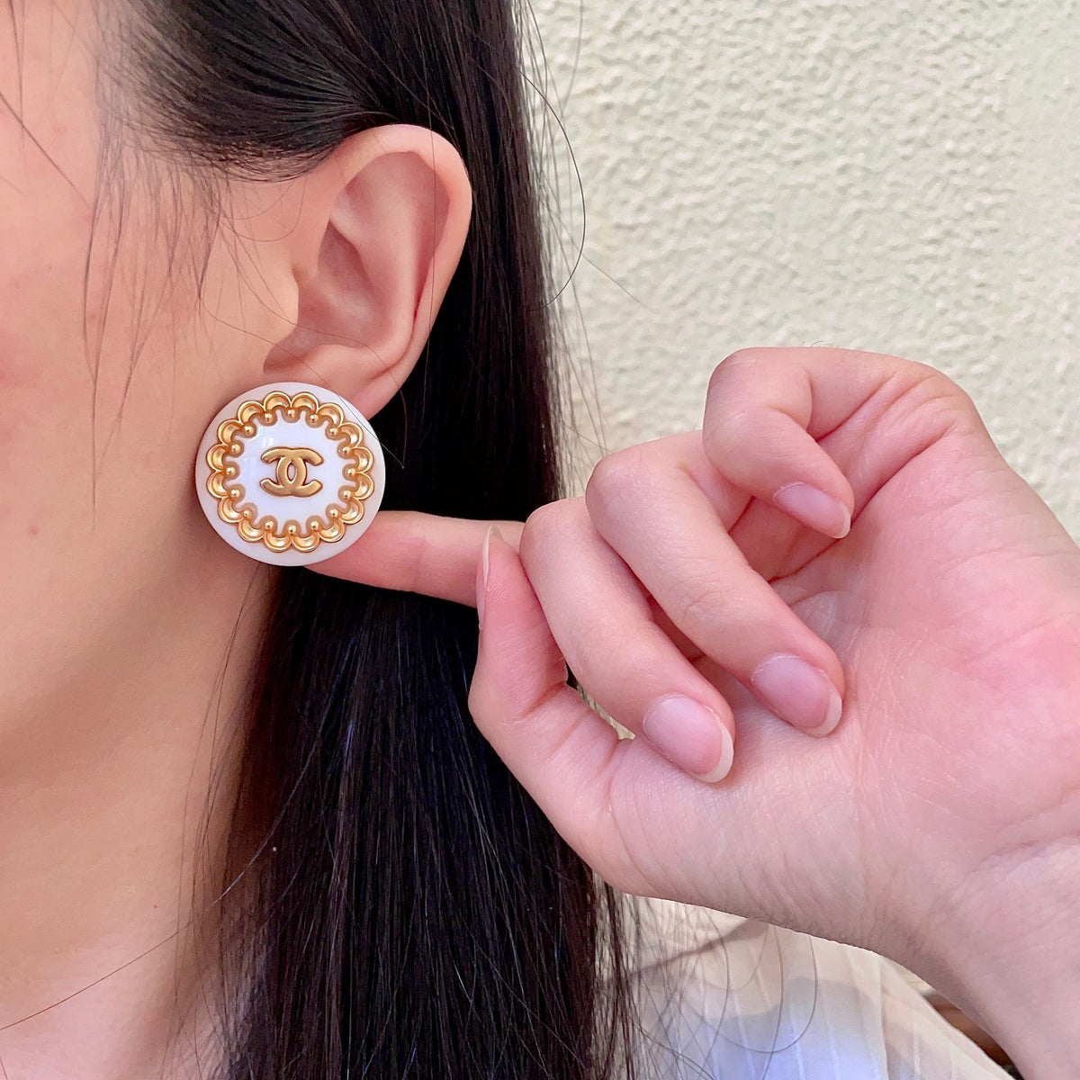 Martin Graham stud earrings in polished metal-tone – front product view