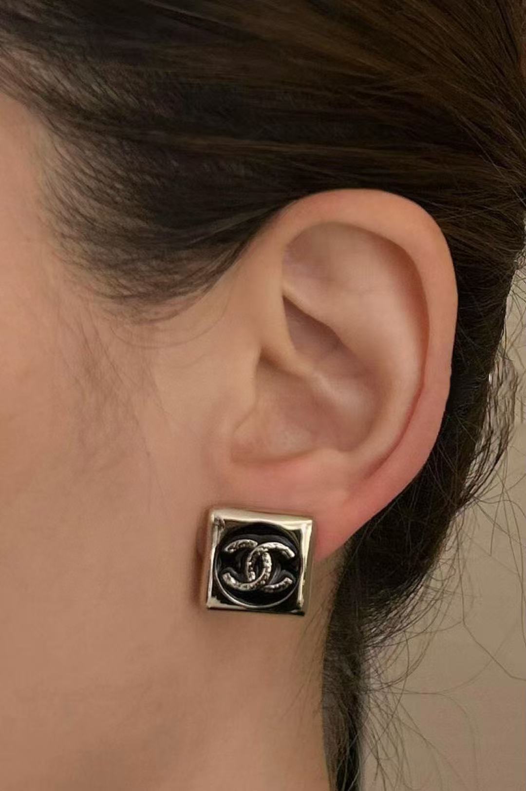 Martin Graham stud earrings in polished metal-tone – front product view