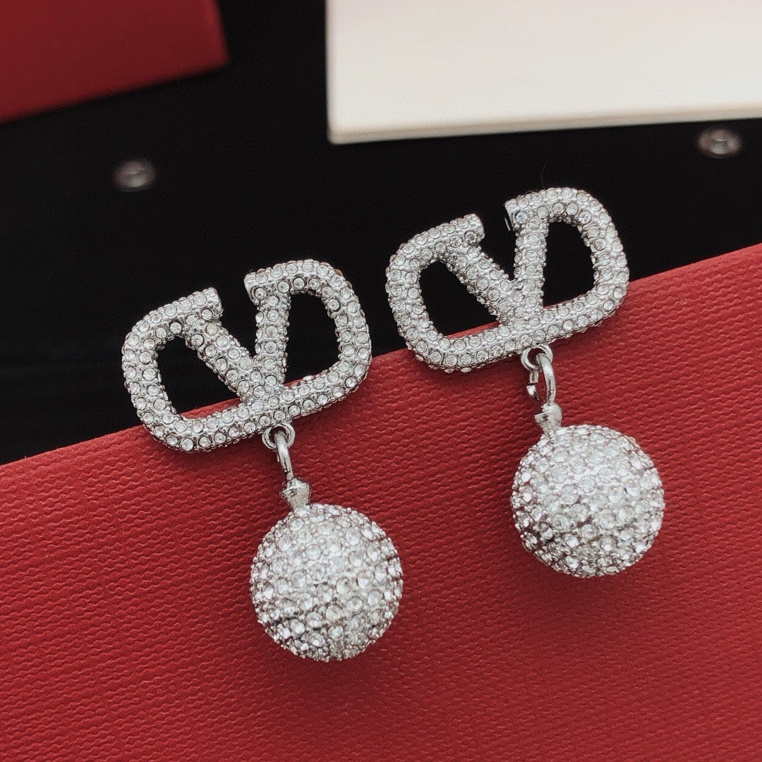 Martin Graham stud earrings in polished metal-tone – front view