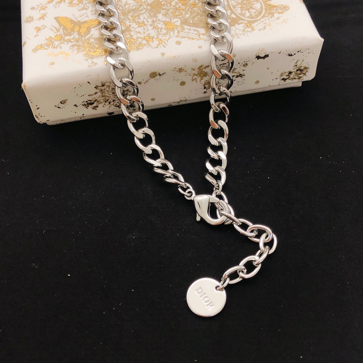 Martin Graham pendant necklace in polished metal-tone – front view