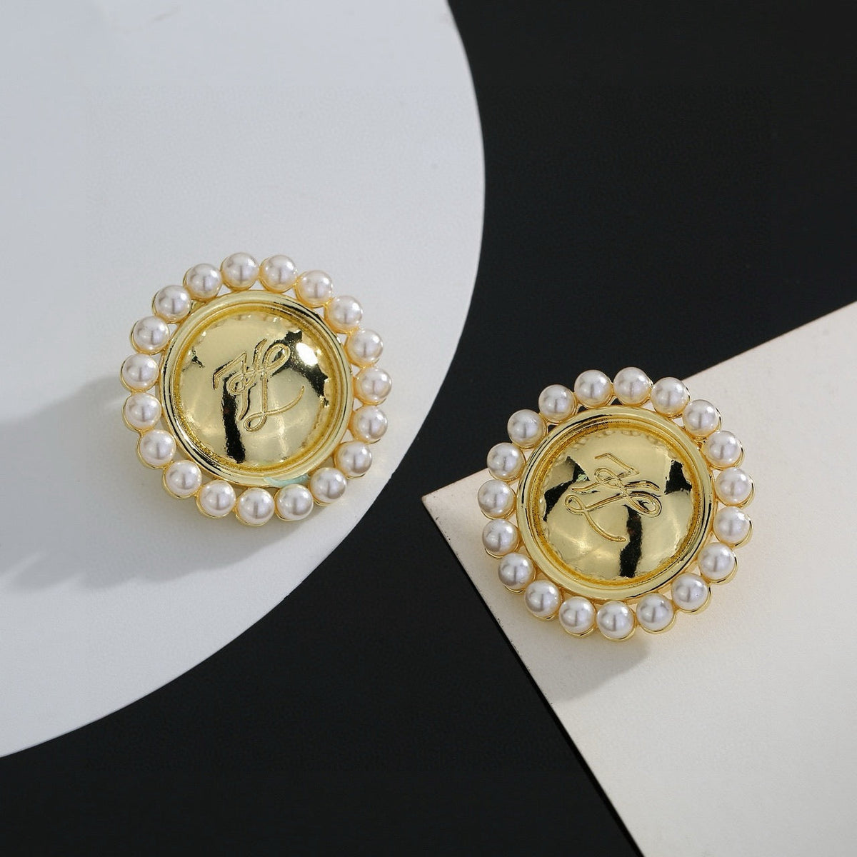 Martin Graham stud earrings in polished metal-tone – front view