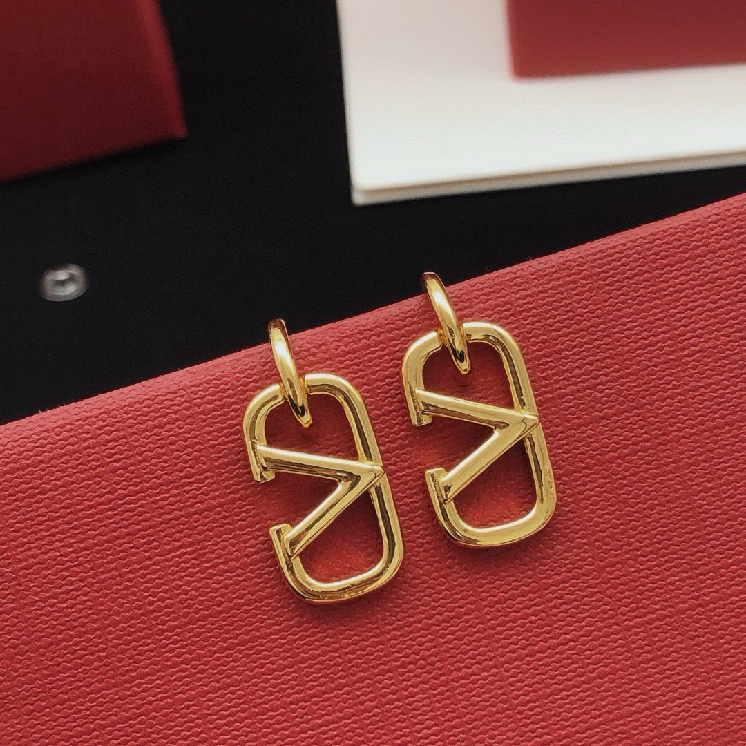 Martin Graham drop earrings in polished metal-tone – front view