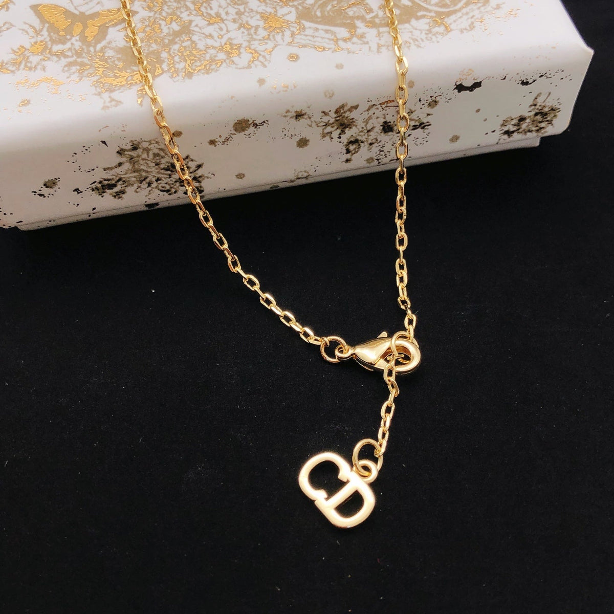 Martin Graham pendant necklace in polished metal-tone – front view