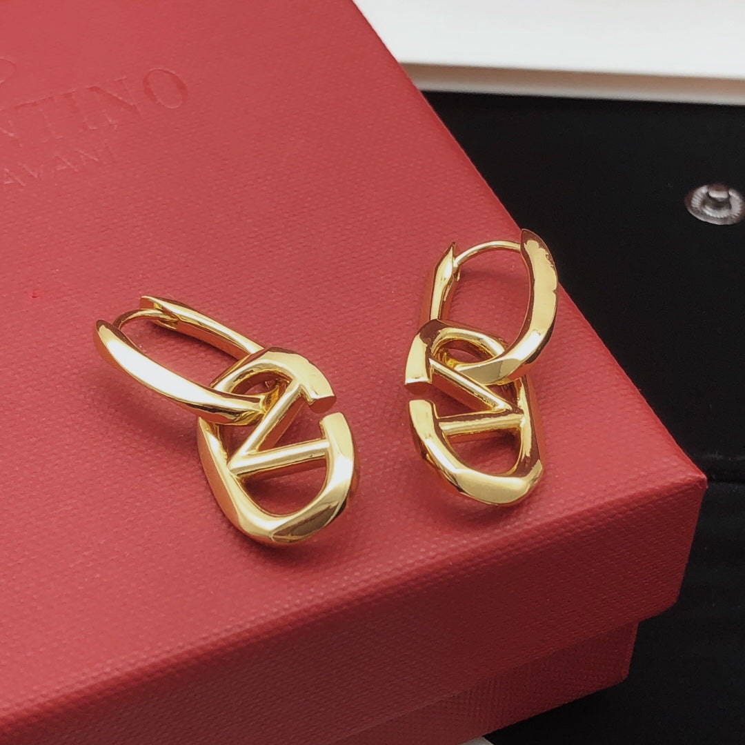 Martin Graham drop earrings in polished metal-tone – front view