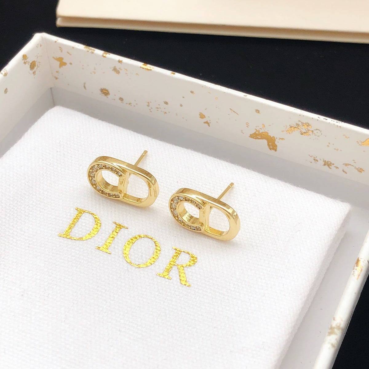 Martin Graham stud earrings in polished metal-tone – front view