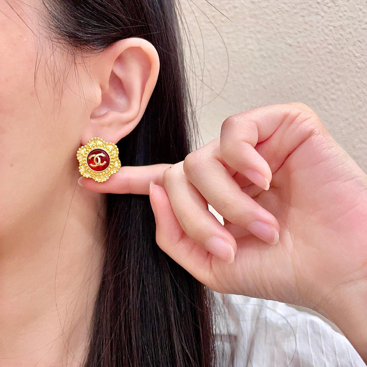 Martin Graham stud earrings in polished metal-tone – front product view