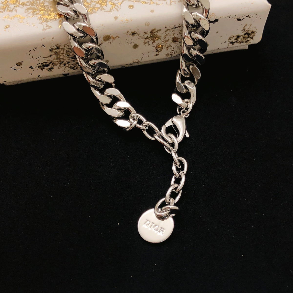 Martin Graham pendant necklace in polished metal-tone – front view
