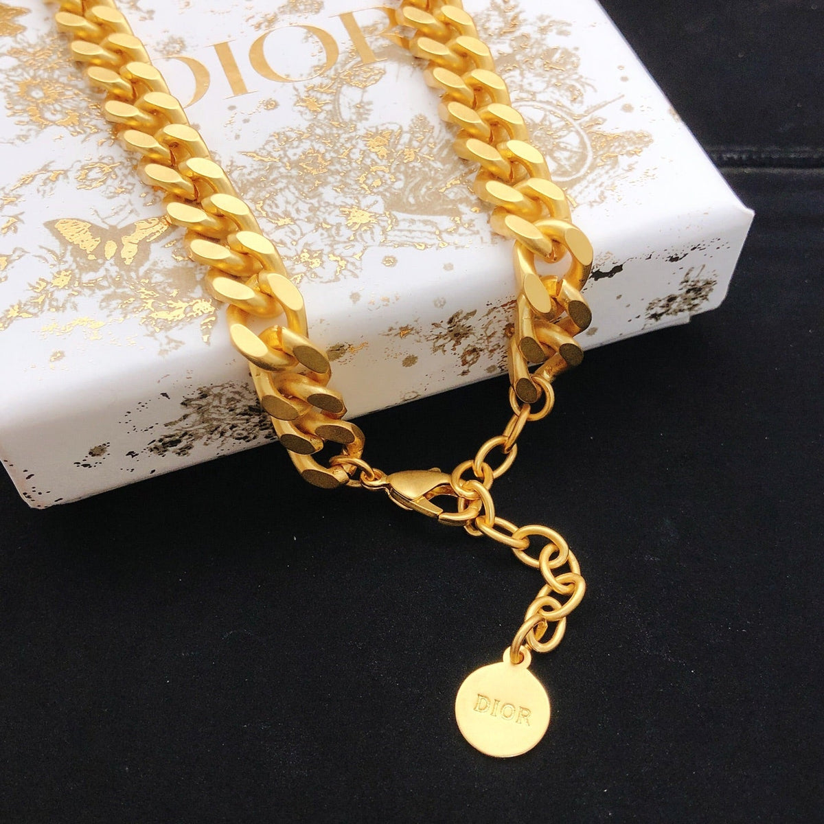 Martin Graham pendant necklace in polished metal-tone – front view