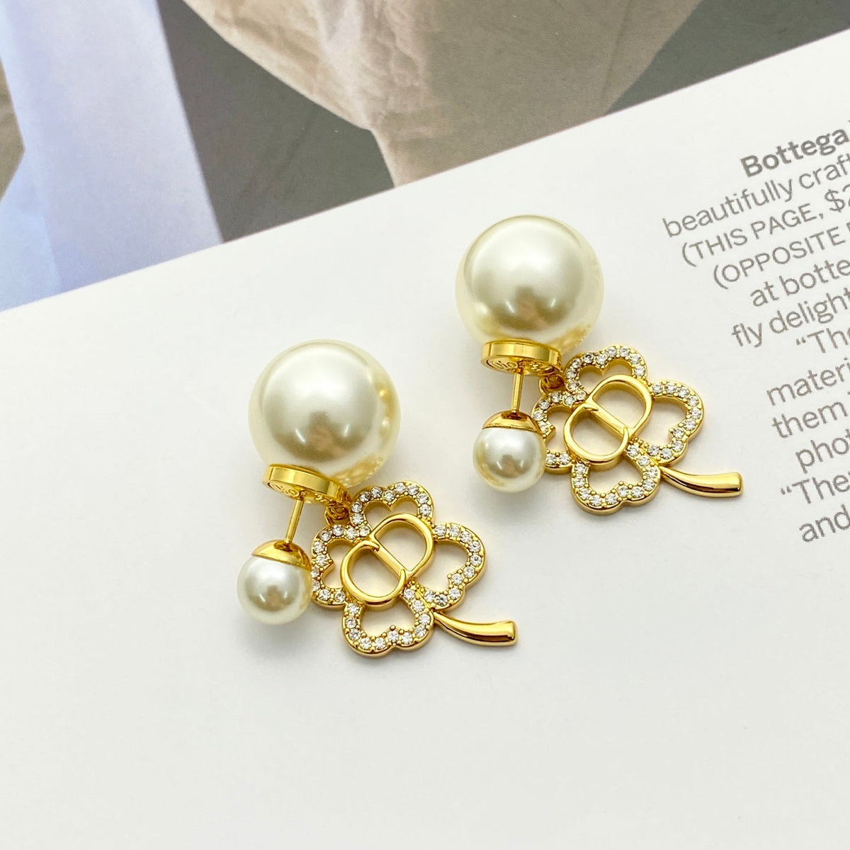 Martin Graham stud earrings in polished metal-tone – front view