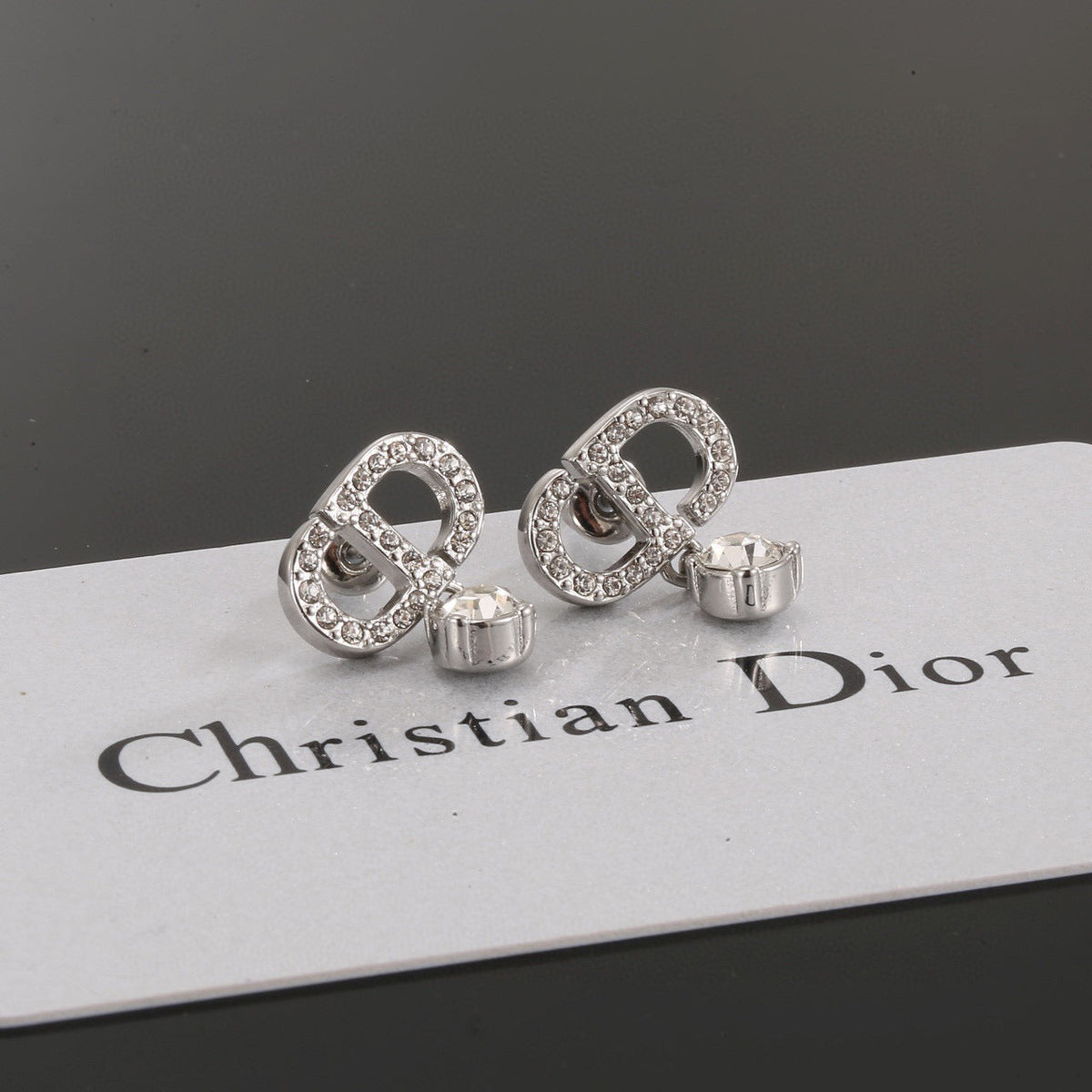 Martin Graham stud earrings in polished metal-tone – front view