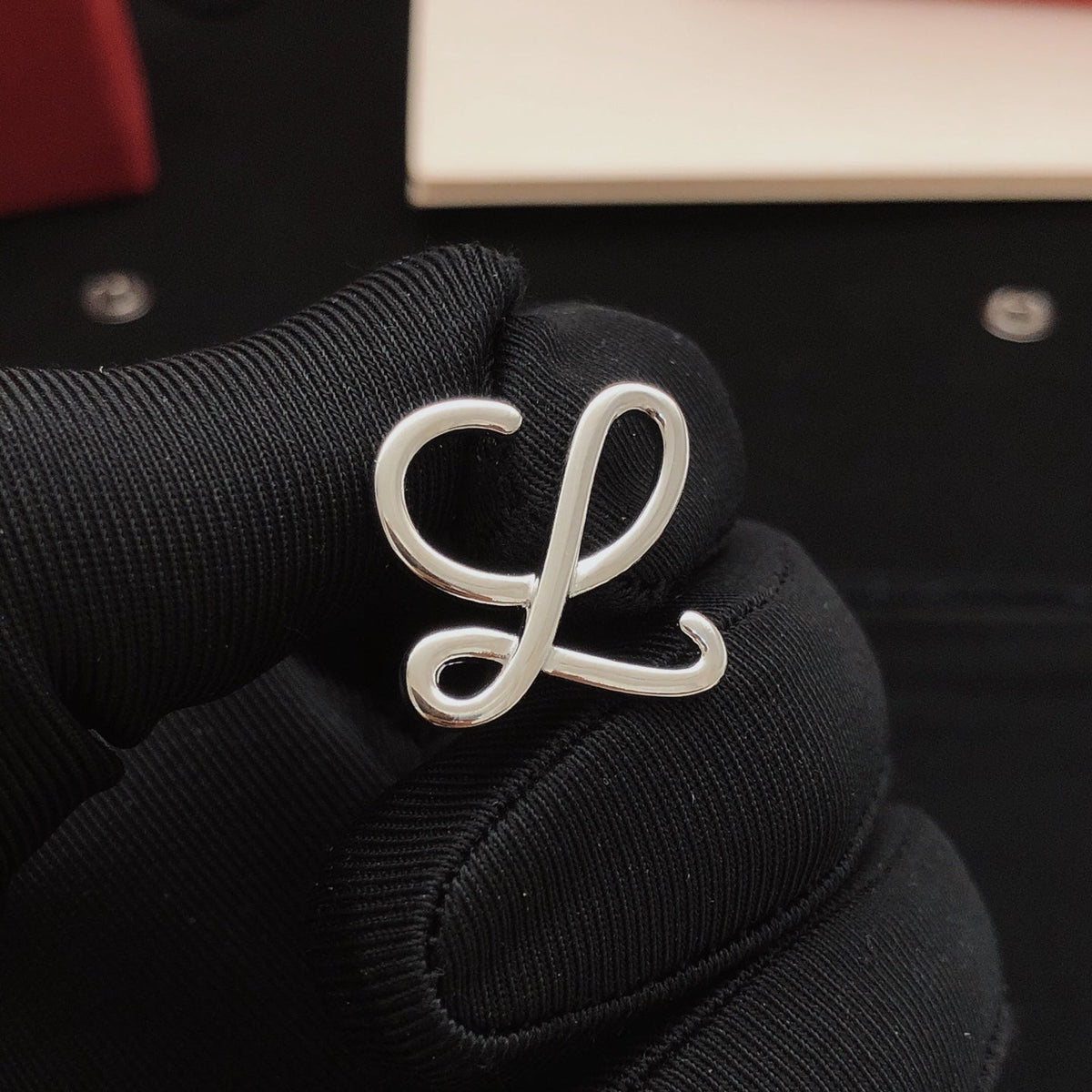 Martin Graham stud earrings in polished metal-tone – front view