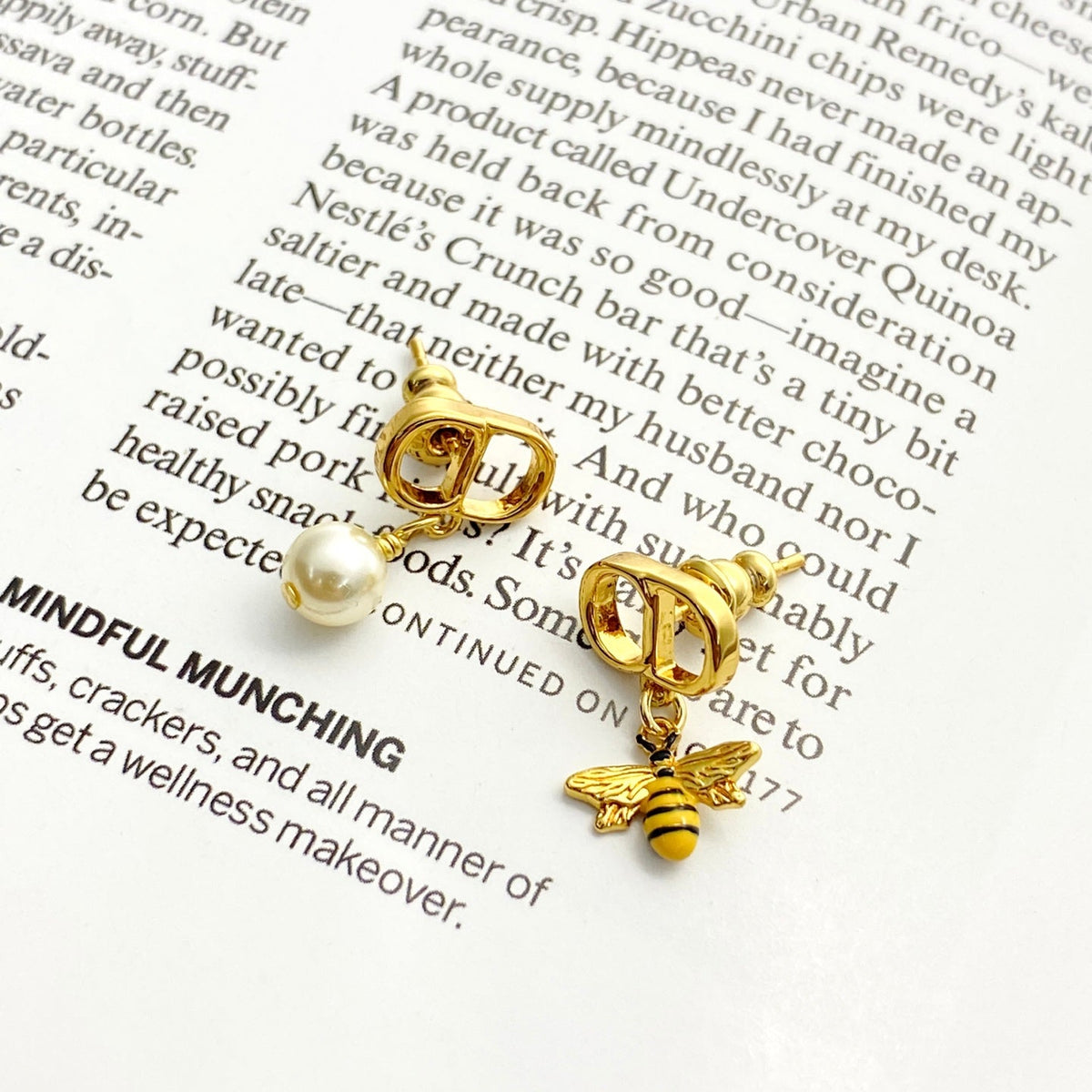 Martin Graham stud earrings in polished metal-tone – front view